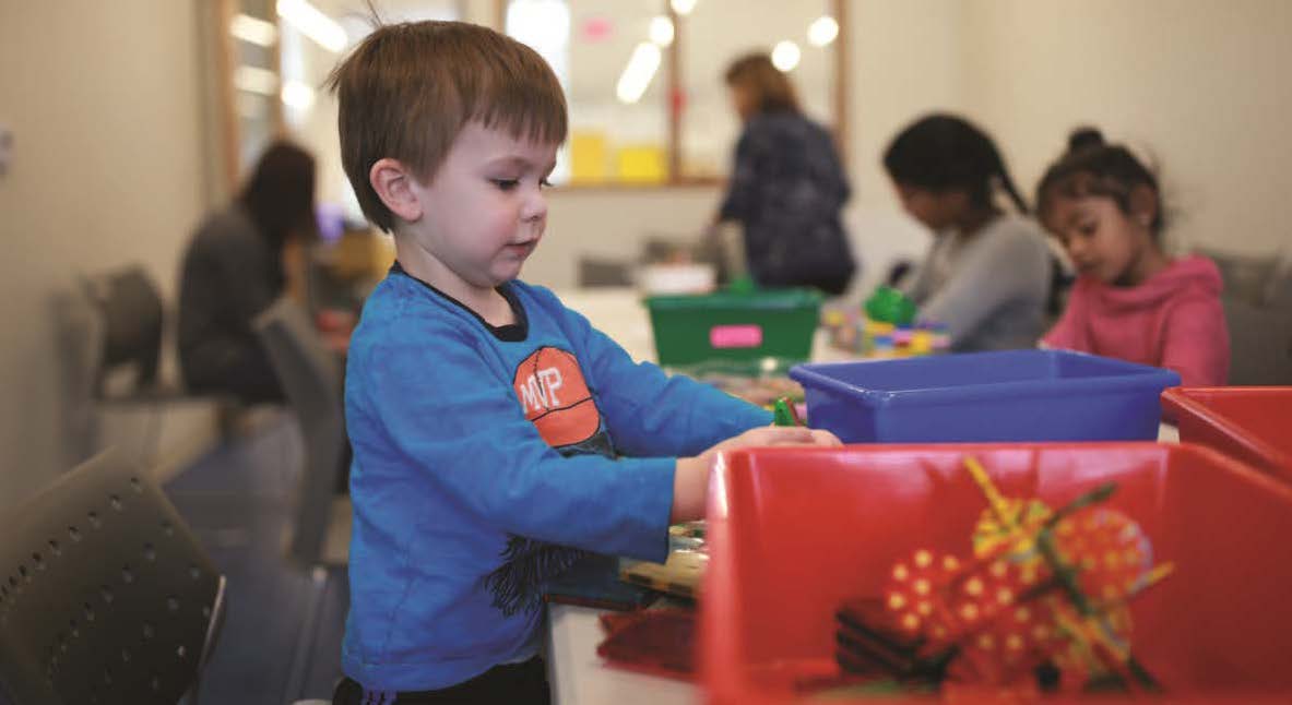 A small child plays with a toy.